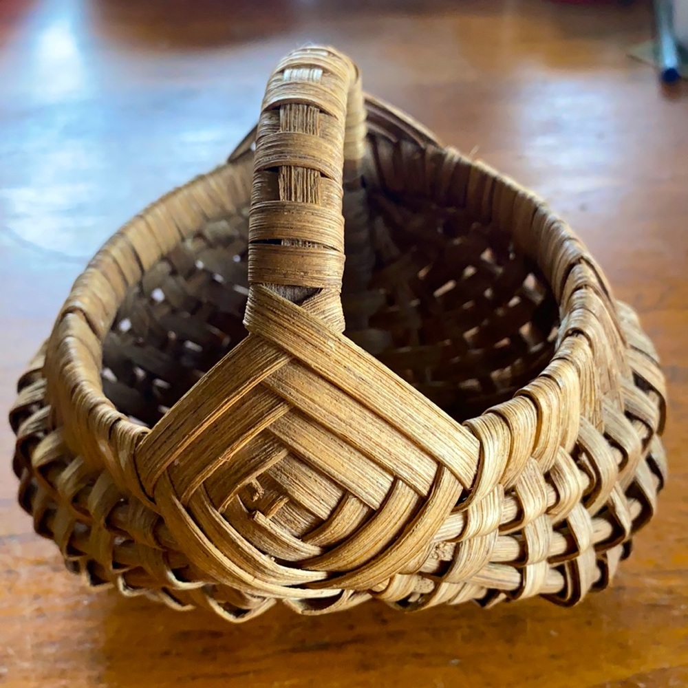 Hand woven walnut color small reed basket